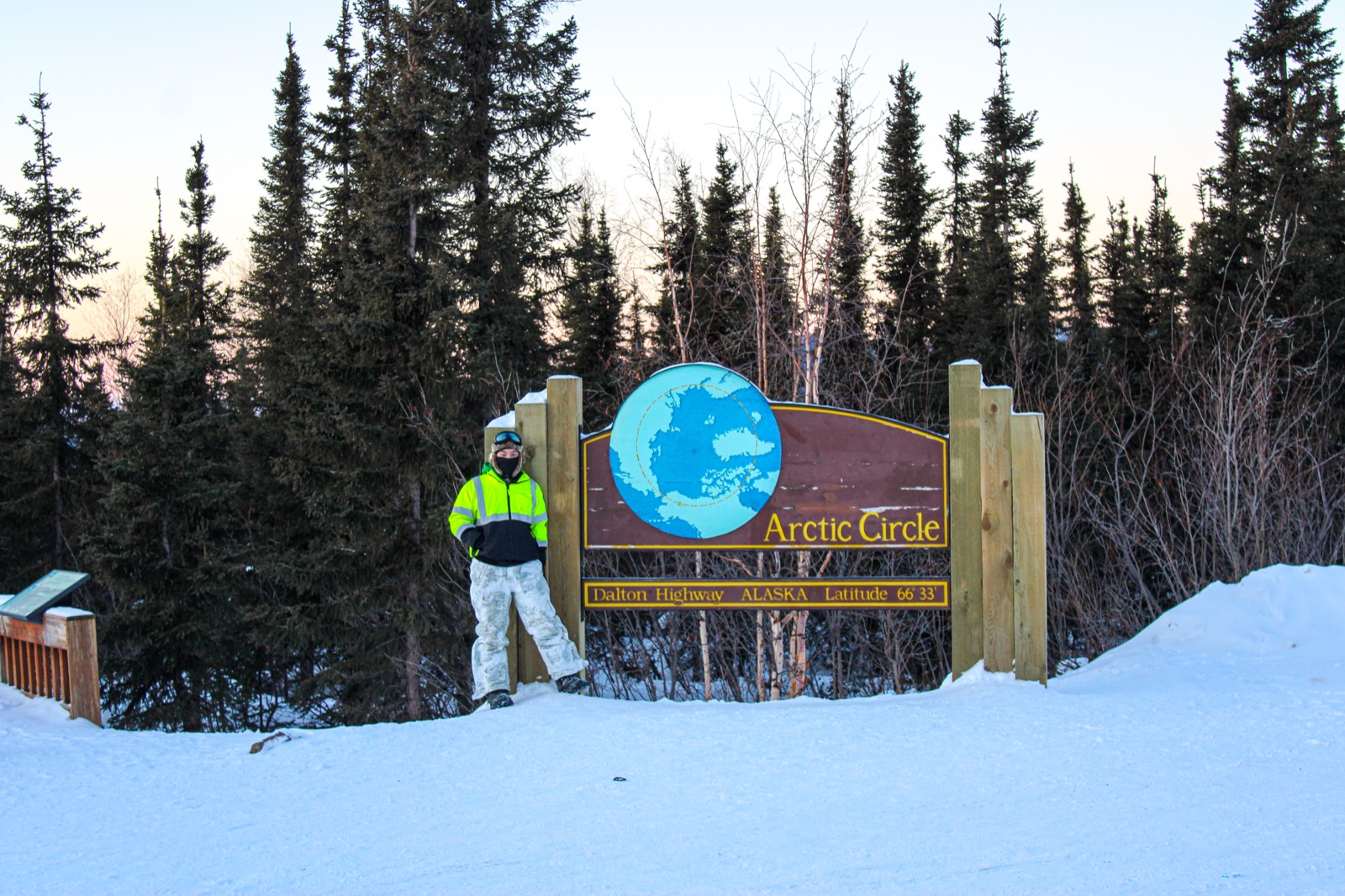 Gerald Fuller at the Arctic Circle sign on the Dalton Highway in winter